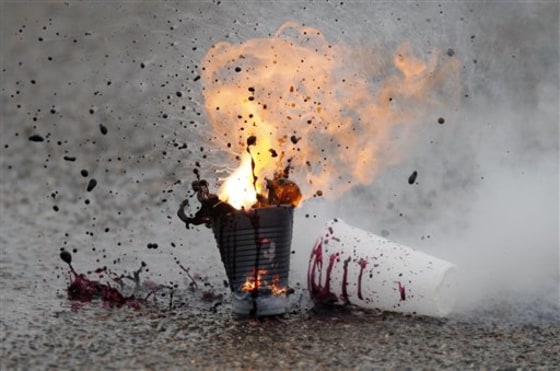 Household chemicals ignite during a class for police officers, fire fighters and first-responders on how to identify, disrupt and dismantle improvised explosive devices.